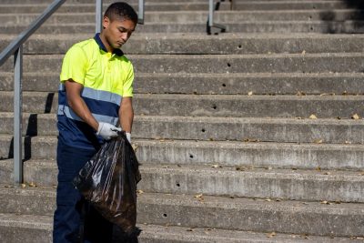 Male Rubbish Collector in Uniform working to keep Sydney green and clean